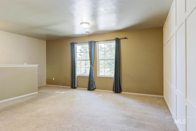4935 N Rathbone Ave, Meridian, ID 83646 - unfurnished room with light colored carpet and baseboards