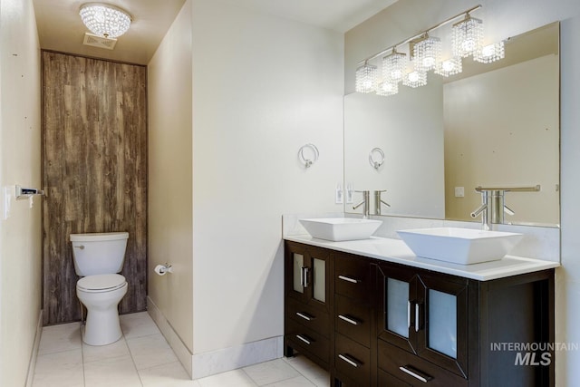 4935 N Rathbone Ave, Meridian, ID 83646 - full bathroom featuring tile patterned floors, double vanity, and a chandelier