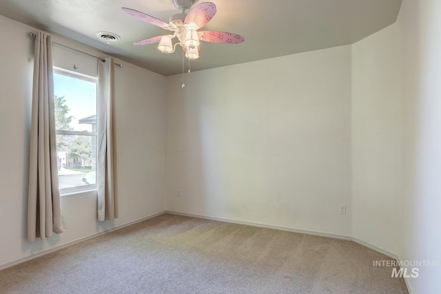 4935 N Rathbone Ave, Meridian, ID 83646 - empty room featuring a ceiling fan and light colored carpet