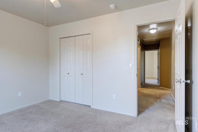 4935 N Rathbone Ave, Meridian, ID 83646 - unfurnished bedroom featuring carpet, a closet, and ceiling fan