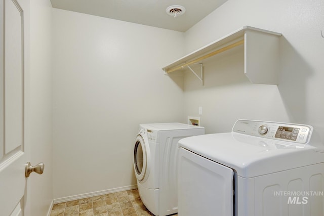 4935 N Rathbone Ave, Meridian, ID 83646 - laundry area featuring separate washer and dryer and baseboards