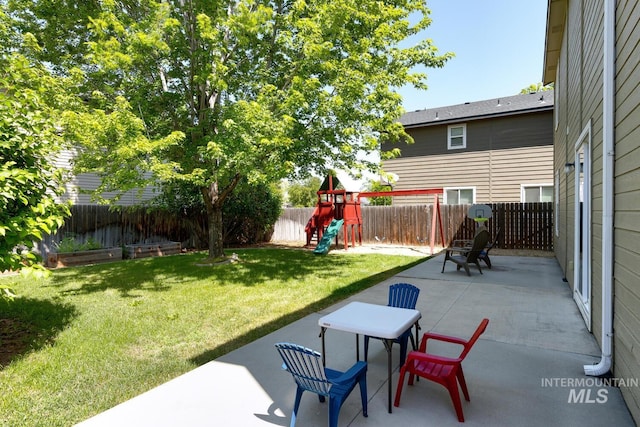 4935 N Rathbone Ave, Meridian, ID 83646 - fenced backyard featuring a playground and a patio area