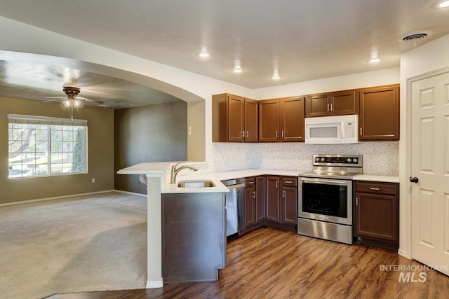 4935 N Rathbone Ave, Meridian, ID 83646 - kitchen featuring stainless steel appliances, a peninsula, light countertops, and ceiling fan