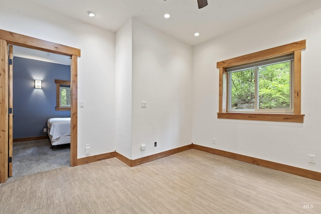 1649 Bear Trl, Donnelly, ID 83615 - unfurnished room featuring light wood-style floors, healthy amount of natural light, a ceiling fan, and recessed lighting