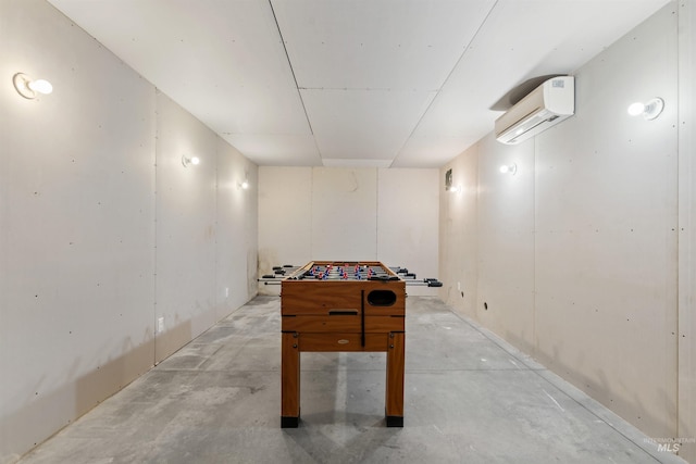 1649 Bear Trl, Donnelly, ID 83615 - rec room with a wall mounted AC and unfinished concrete flooring
