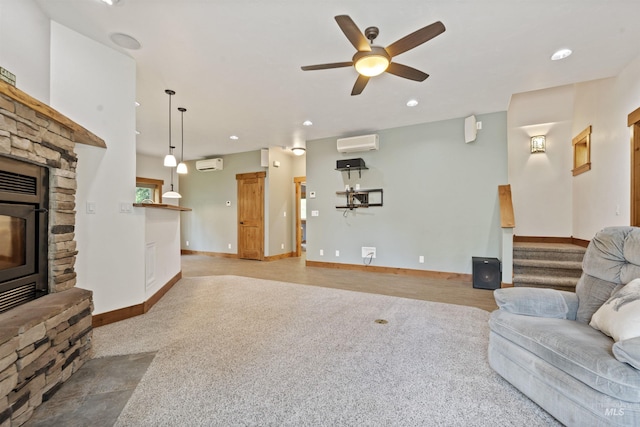 1649 Bear Trl, Donnelly, ID 83615 - living area featuring a wall mounted air conditioner, a stone fireplace, ceiling fan, an AC wall unit, and stairway