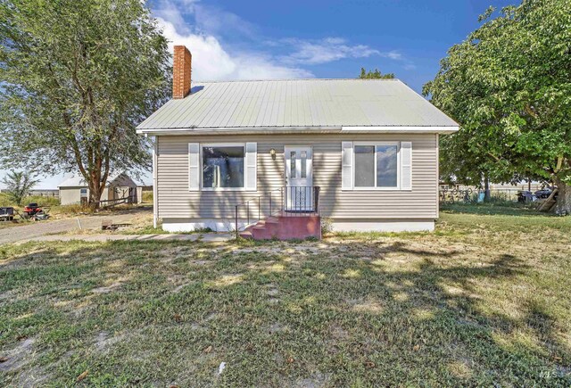 bungalow with a front yard