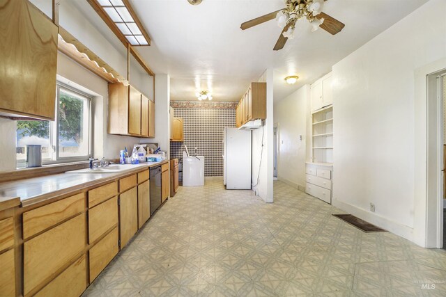 kitchen featuring ceiling fan, white refrigerator, sink, and black dishwasher