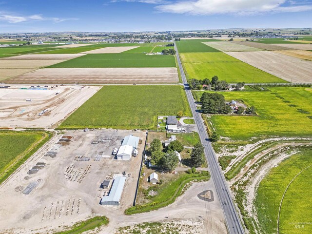 birds eye view of property featuring a rural view