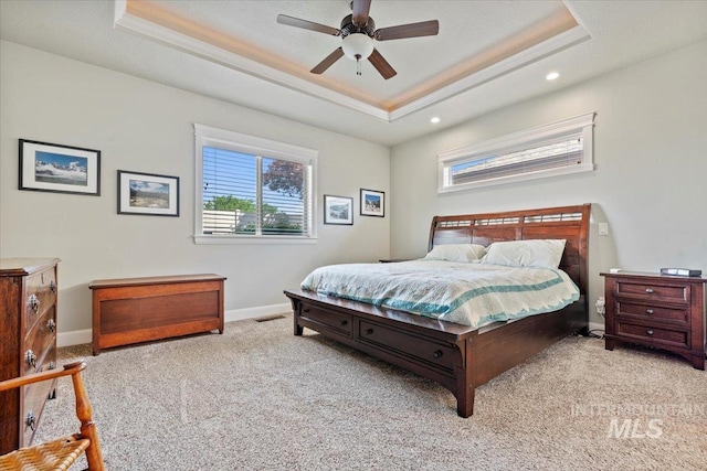2706 E Rochester Ct, Meridian, ID 83646 - carpeted bedroom with a tray ceiling, baseboards, recessed lighting, crown molding, and ceiling fan