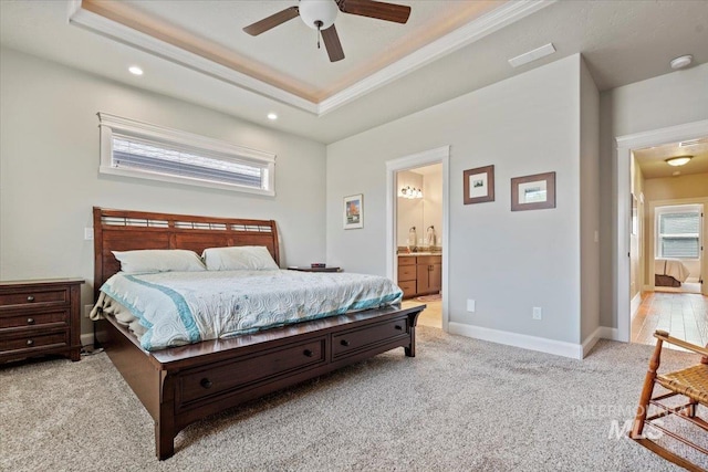 2706 E Rochester Ct, Meridian, ID 83646 - carpeted bedroom featuring a raised ceiling, connected bathroom, recessed lighting, ornamental molding, and baseboards