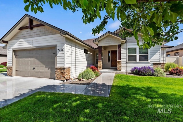 2706 E Rochester Ct, Meridian, ID 83646 - view of front of house with stone siding, a garage, a front lawn, and driveway