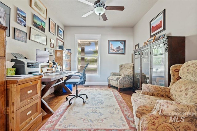 2706 E Rochester Ct, Meridian, ID 83646 - office with a ceiling fan, wood finished floors, and baseboards