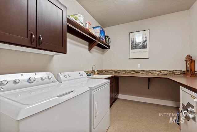 2706 E Rochester Ct, Meridian, ID 83646 - laundry room featuring cabinet space, light colored carpet, washing machine and clothes dryer, and an office area