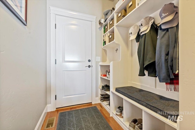 2706 E Rochester Ct, Meridian, ID 83646 - mudroom featuring wood finished floors and baseboards