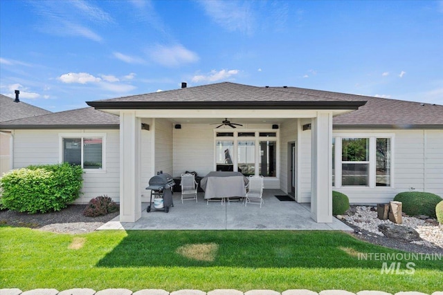 2706 E Rochester Ct, Meridian, ID 83646 - back of property with a ceiling fan, a patio, a lawn, outdoor lounge area, and a shingled roof