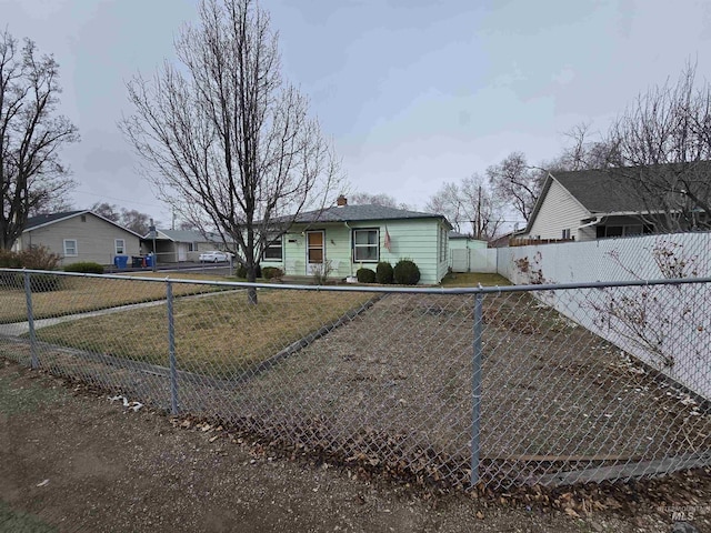 view of front of property with a chimney and fence private yard