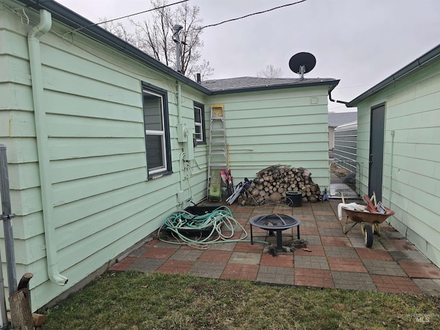 view of patio / terrace featuring a fire pit