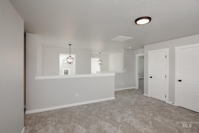 empty room with baseboards and carpet floors