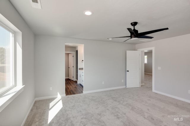 carpeted empty room with recessed lighting, visible vents, baseboards, and ceiling fan