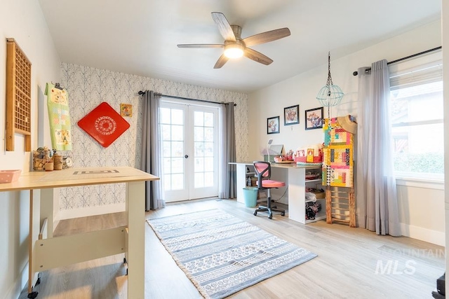 office featuring hardwood / wood-style flooring, ceiling fan, and french doors