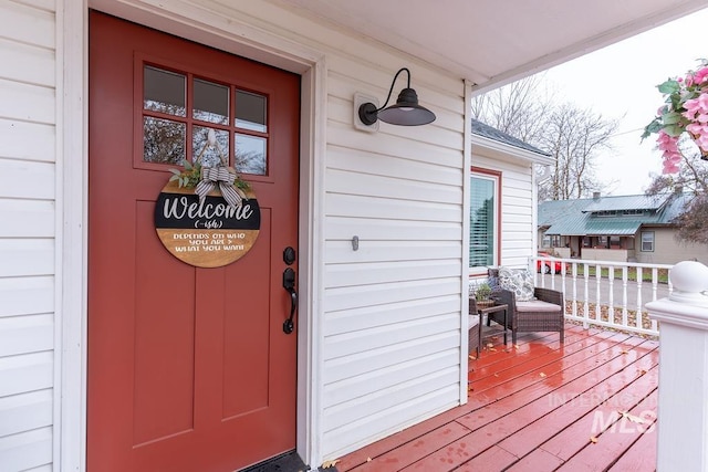 doorway to property featuring covered porch