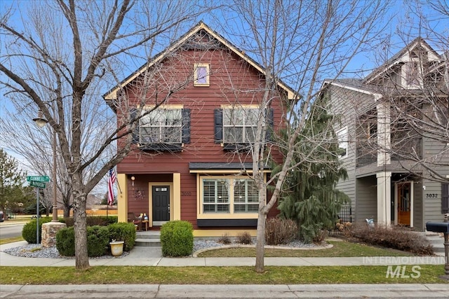 view of front of house with a balcony