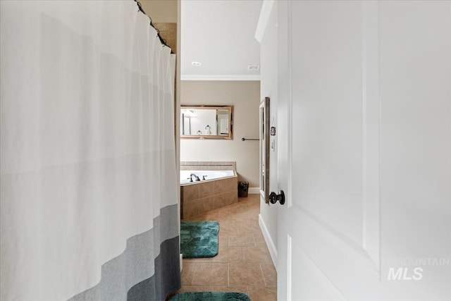 full bath with tile patterned floors, visible vents, tiled tub, and a shower with shower curtain