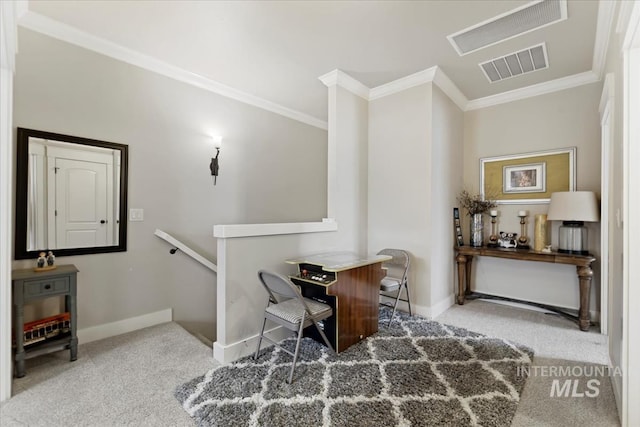 home office with visible vents, carpet floors, baseboards, and ornamental molding