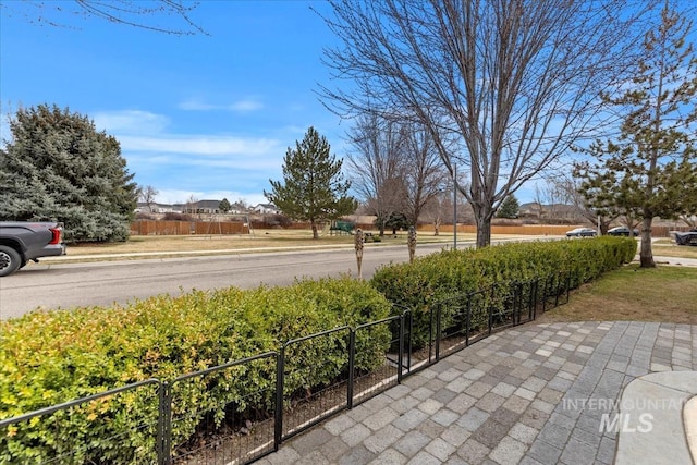 view of patio featuring fence