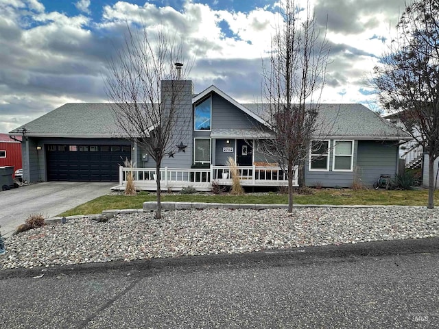 view of front of property featuring a porch and a garage