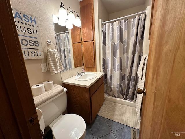 bathroom featuring vanity, toilet, tile patterned flooring, and a shower with shower curtain