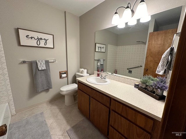 bathroom featuring toilet, vanity, a shower, and tile patterned floors