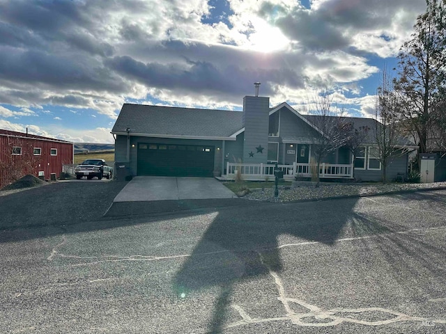 view of front facade with a porch and a garage