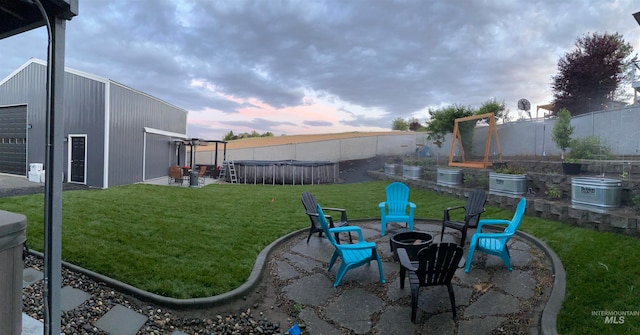 view of yard with a patio and a fire pit