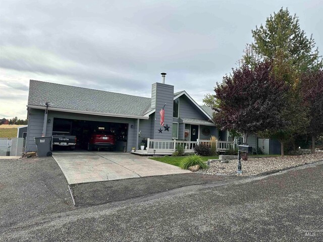 view of front facade with a garage and a porch