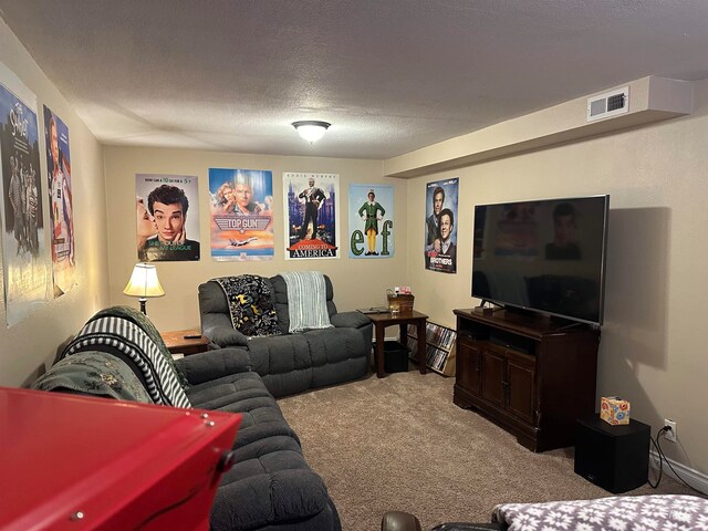 living room featuring carpet and a textured ceiling