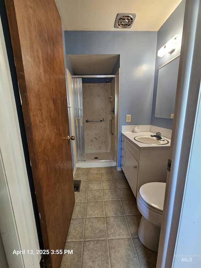 314 S Phillippi St, Boise, ID 83705 - full bath with vanity, toilet, a shower stall, and tile patterned flooring