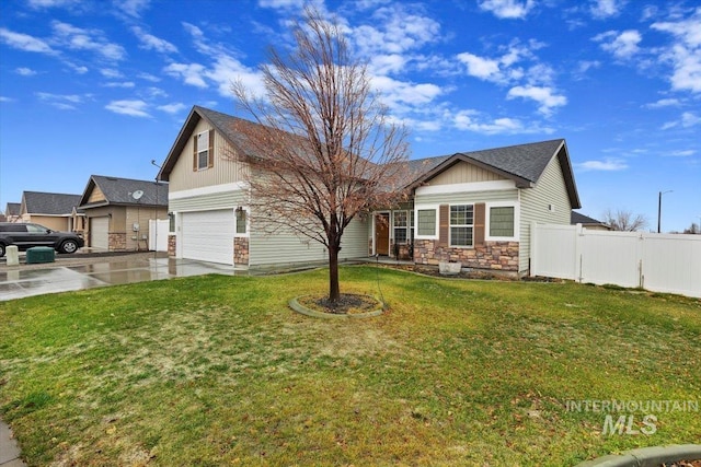 view of front of home featuring a garage and a front yard