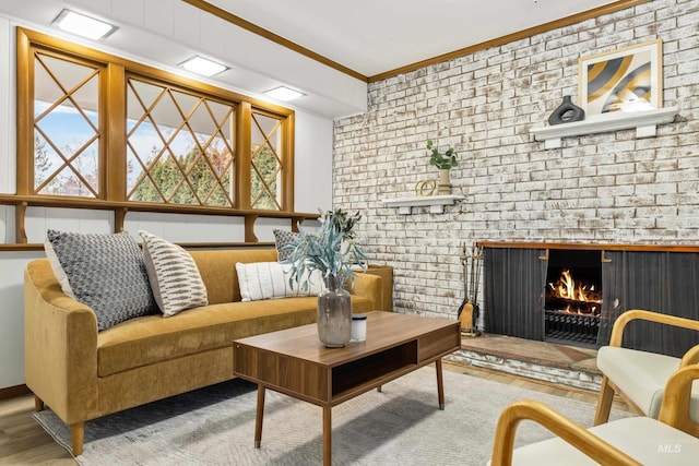 interior space with crown molding, wood finished floors, and a fireplace