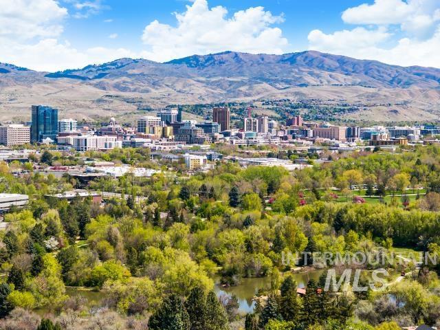 bird's eye view with a view of city and a mountain view