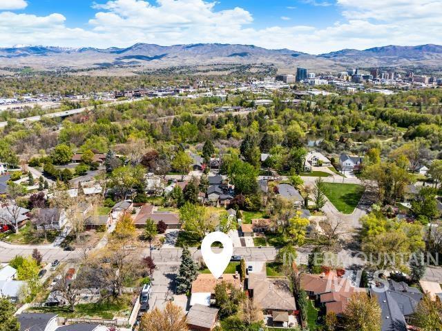 birds eye view of property with a residential view and a mountain view
