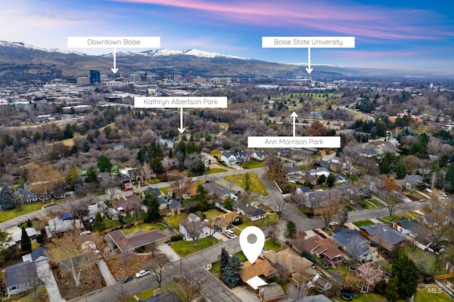 aerial view at dusk with a residential view and a mountain view
