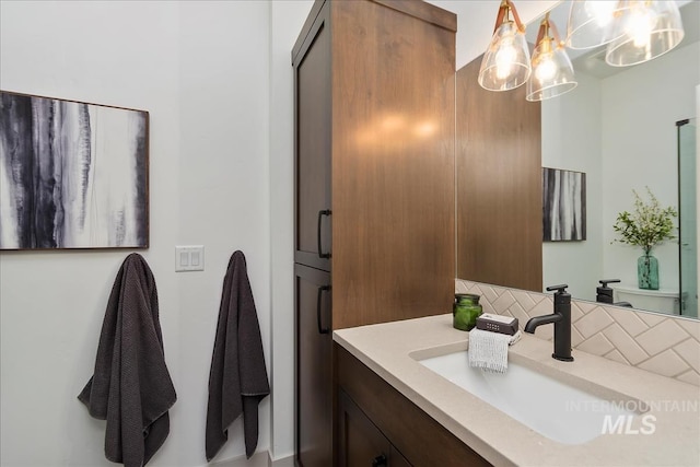 bathroom featuring backsplash and vanity