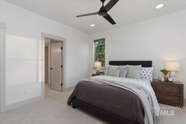 bedroom featuring recessed lighting, baseboards, light colored carpet, and ceiling fan