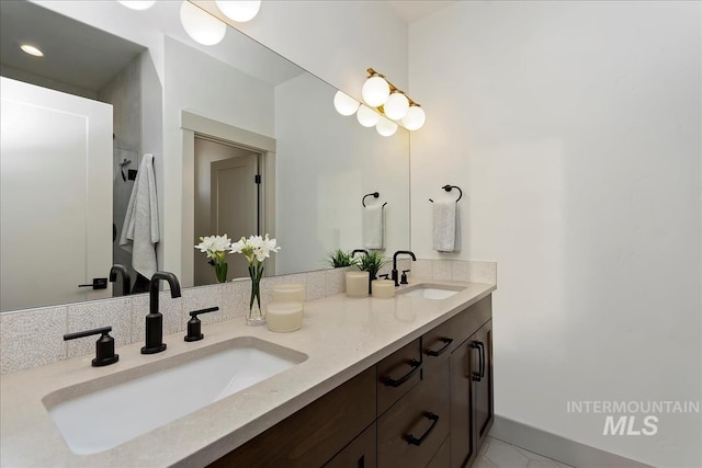 bathroom with double vanity and a sink