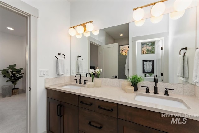 bathroom featuring double vanity and a sink