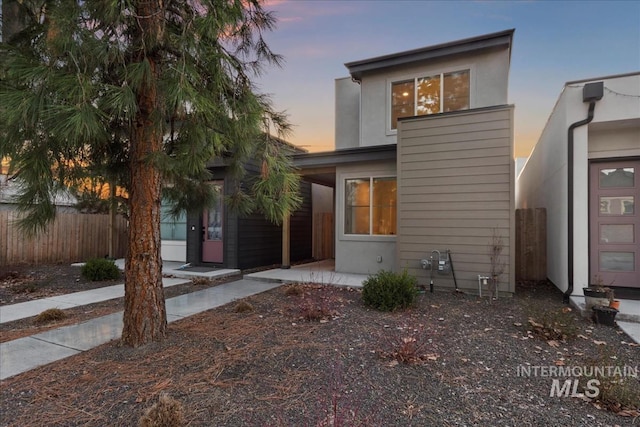 view of front of home with fence