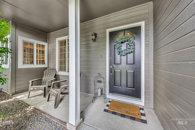 entrance to property with covered porch