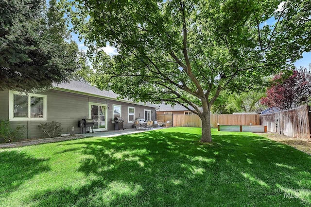view of yard featuring a fenced backyard and a patio